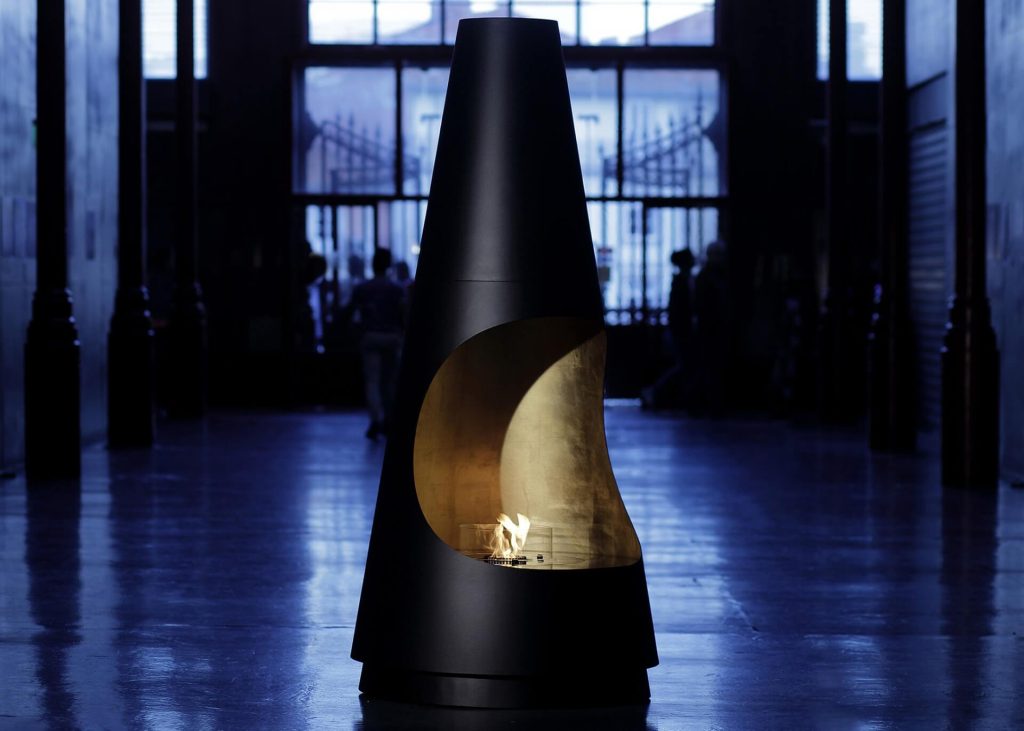 Archimedes bioethanol fireplace by GlammFire in a dramatic indoor setting