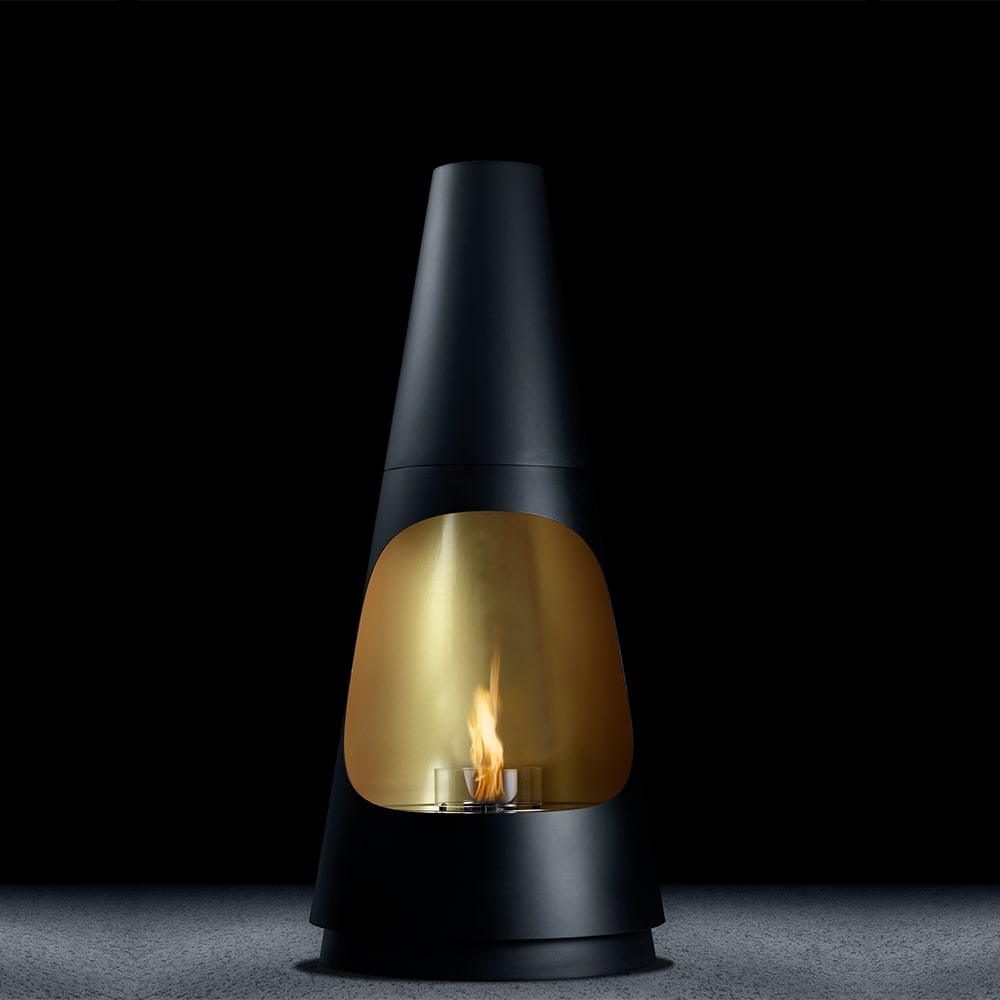 Front view of Archimedes bioethanol fireplace by GlammFire with black and gold design in a dark minimalist setting