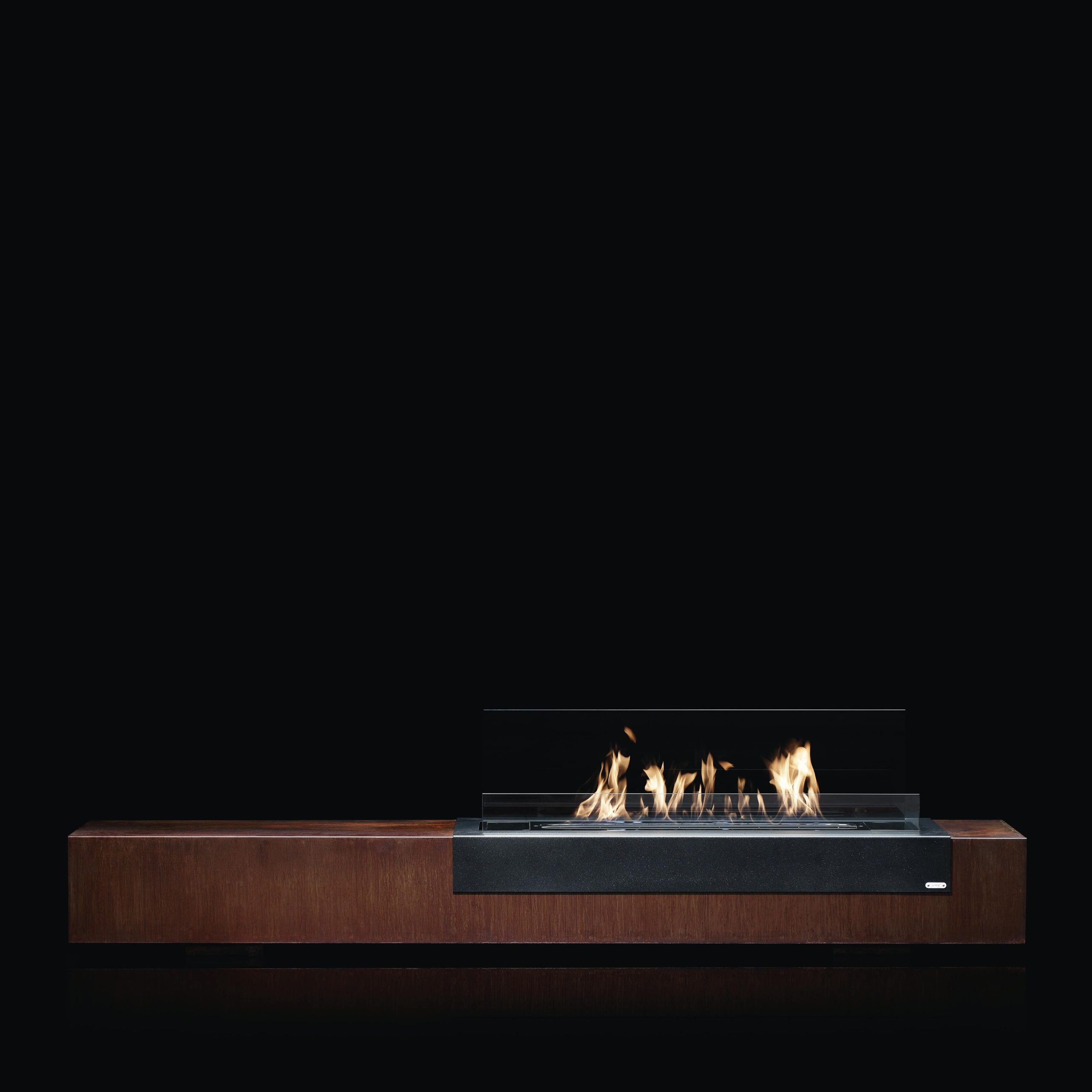 Loft bioethanol floor fireplace by GlammFire with sleek wooden base and modern glass protector, offering a clean and eco-friendly flame.