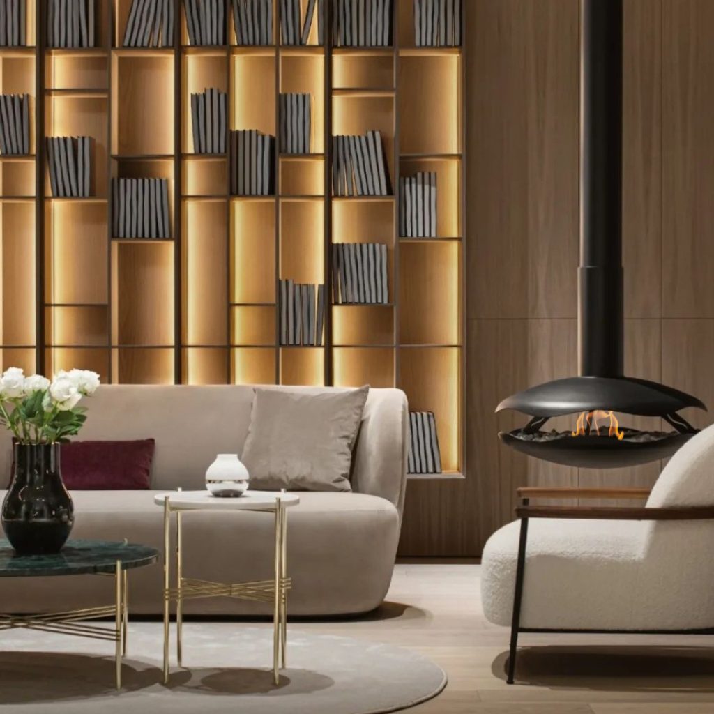 Perola suspended bioethanol fireplace by GlammFire in a modern living room with warm wood accents and elegant furniture