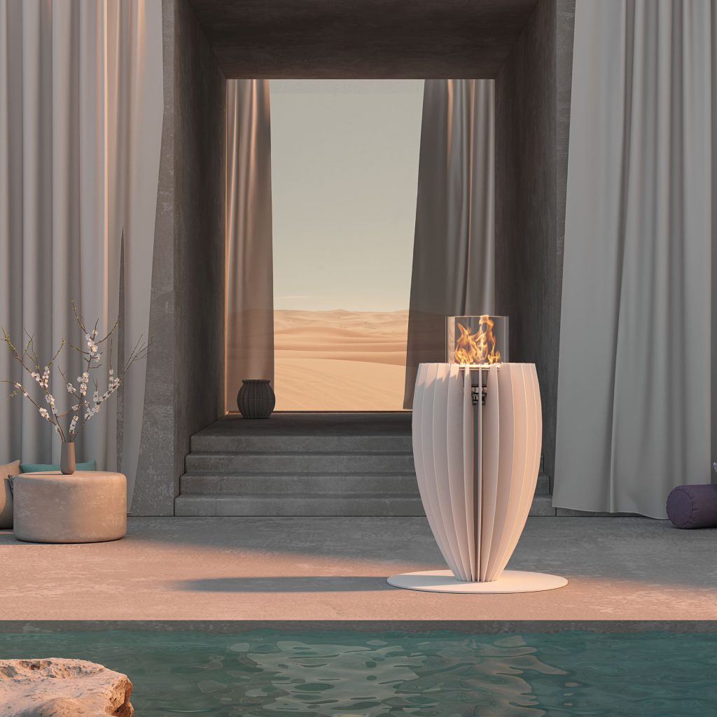Tuli bioethanol floor fireplace by GlammFire in white finish, placed by a pool with desert view