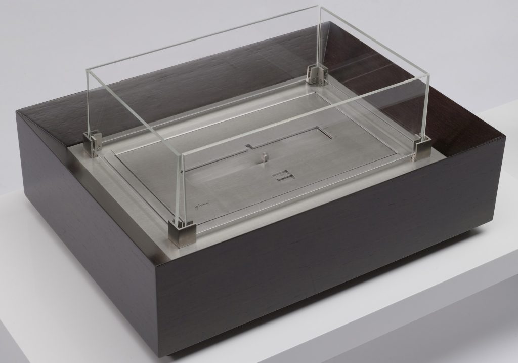 Burner II bioethanol fireplace displayed in a studio setting, showcasing its modern design and elegant flames.