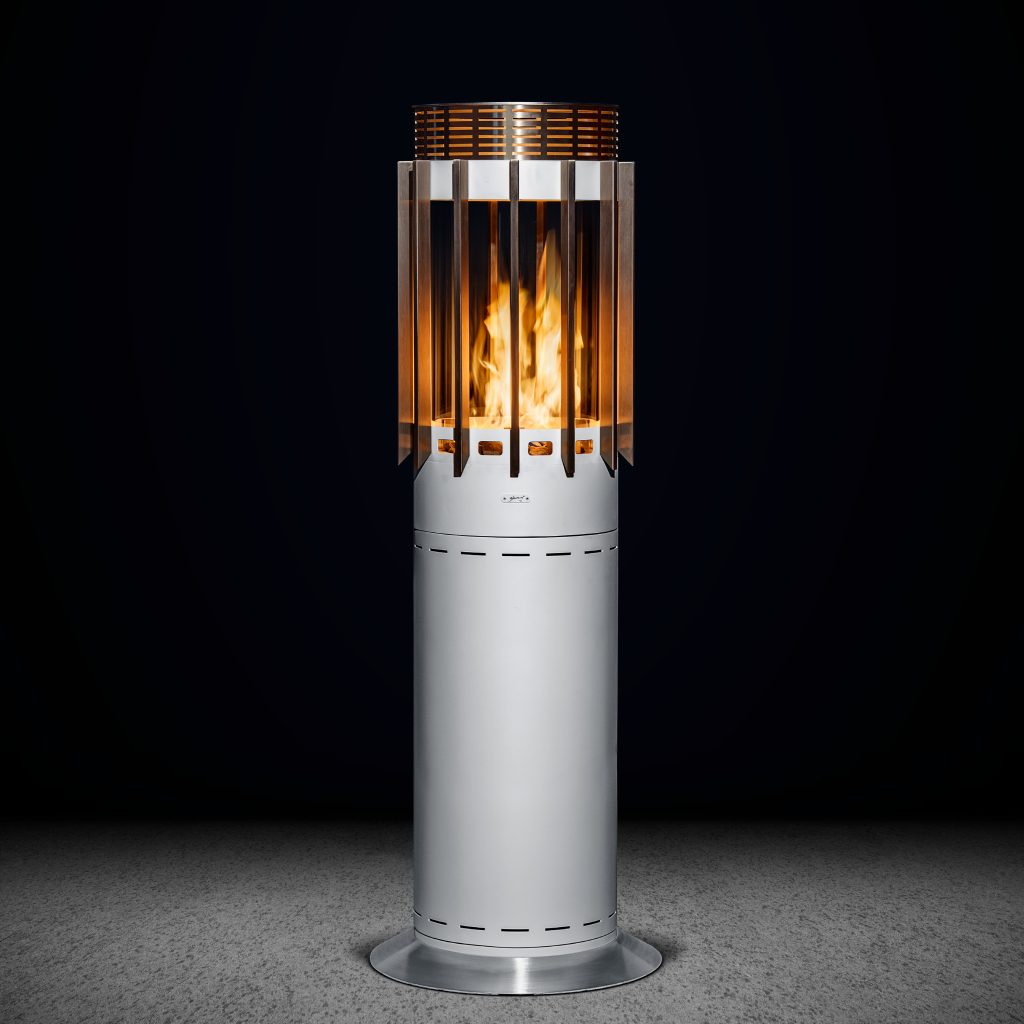 Selene Hedges outdoor gas heater by GlammFire, featuring a sleek and modern cylindrical design with vertical cut-outs for a stylish heating solution in outdoor settings.
