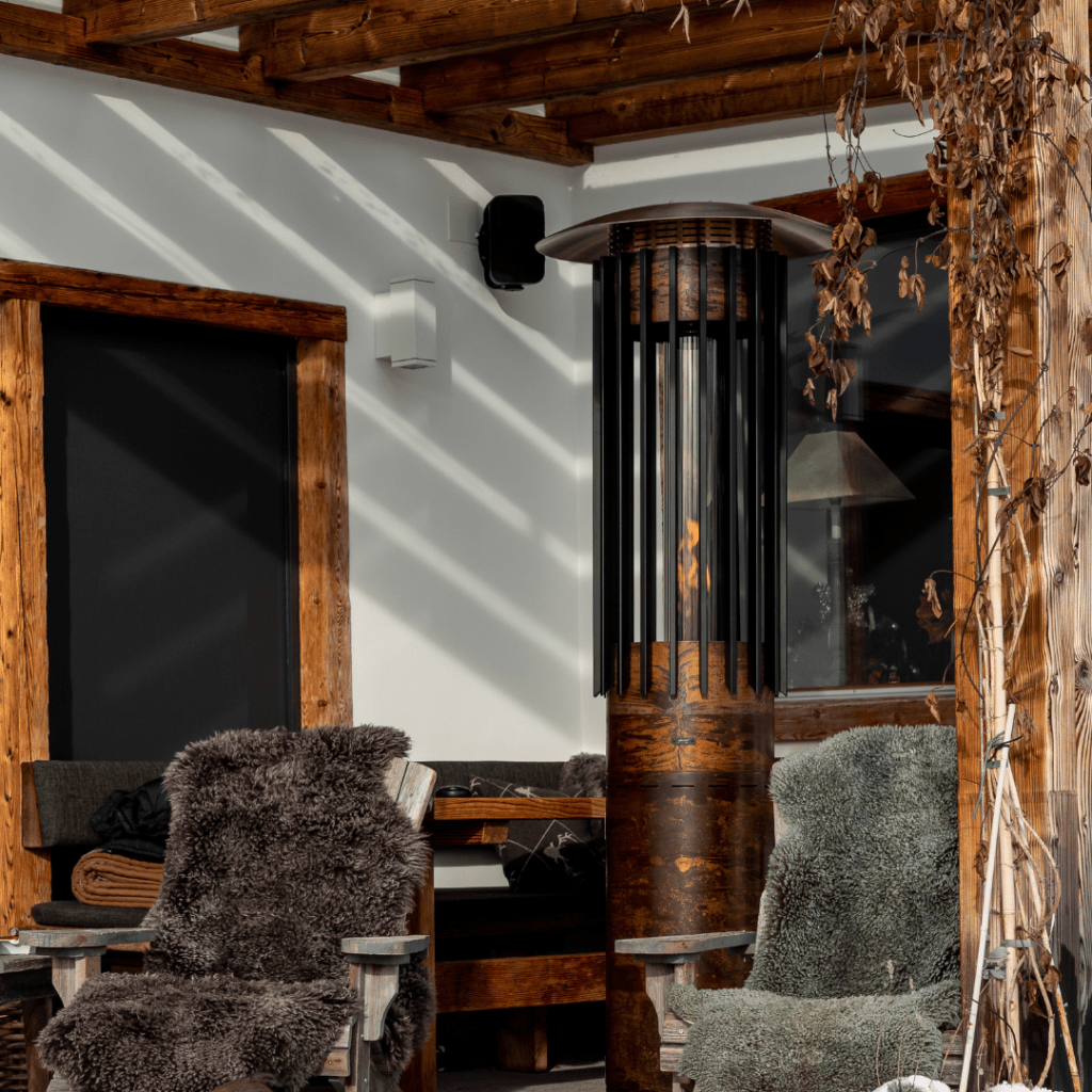Hyperion Hedges outdoor gas heater by GlammFire with a rustic industrial design, perfect for outdoor lounging areas.