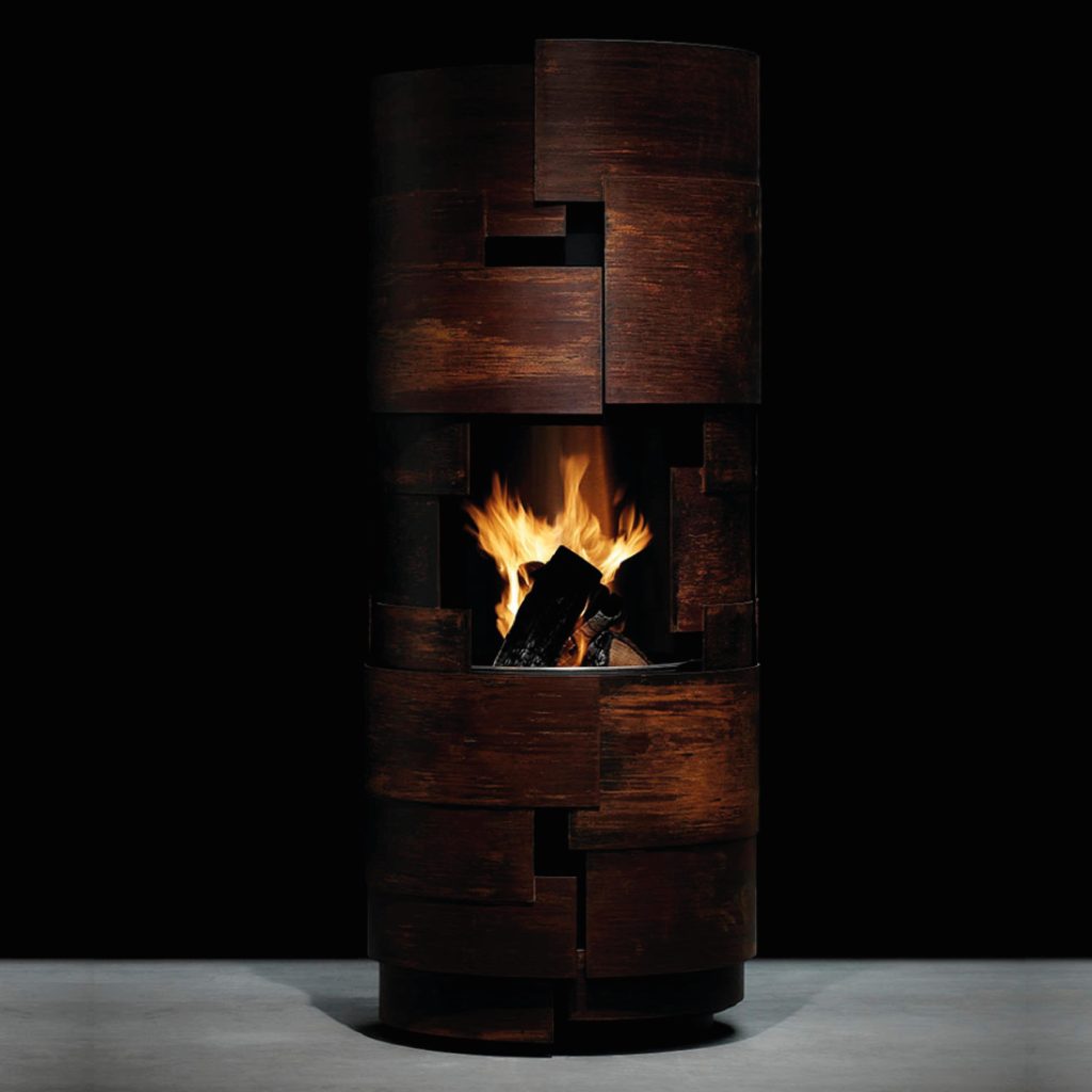 Barbecue Intermezzo by GlammFire in a modern rustic design, featuring a cylindrical shape with a warm fire glow, ideal for outdoor gatherings and grilling.
