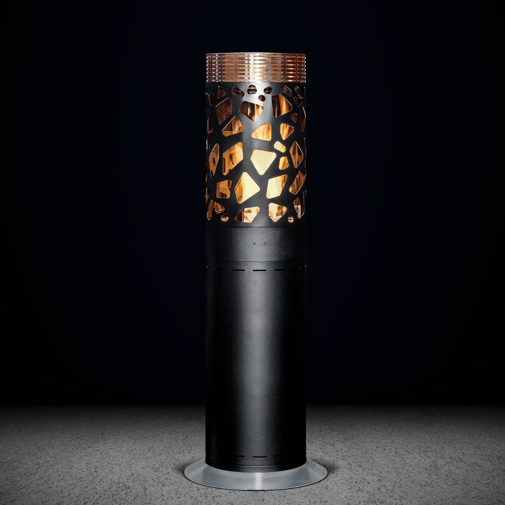 Selene Tile outdoor gas heater by GlammFire, showcasing a modern black cylindrical design with artistic cutouts illuminated from within, ideal for stylish outdoor spaces.
