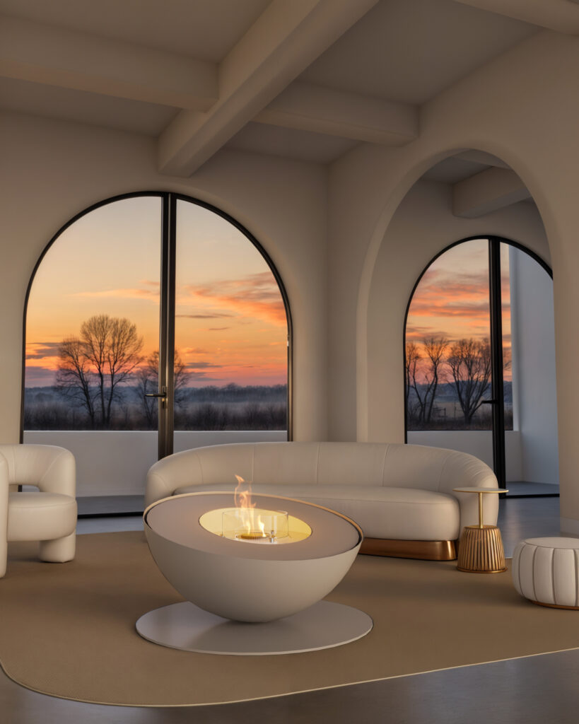 Lareira de chão Mileto a bioetanol da GlammFire em acabamento branco, integrada em sala elegante com vista para o pôr do sol.