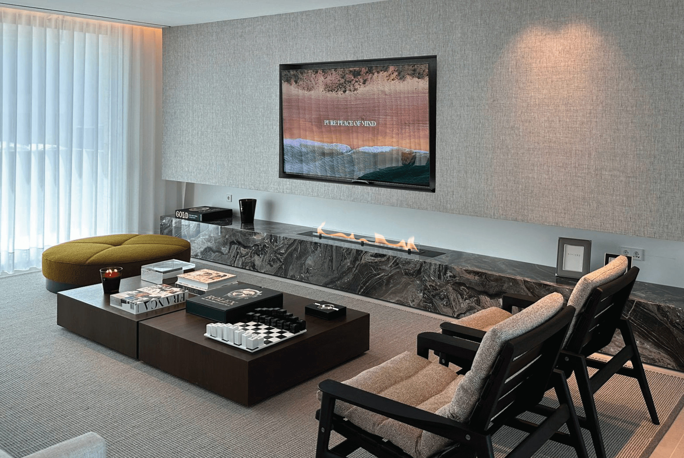 Fire Line Evoplus bioethanol fireplace in a luxurious living room integrated into a stone structure under a television