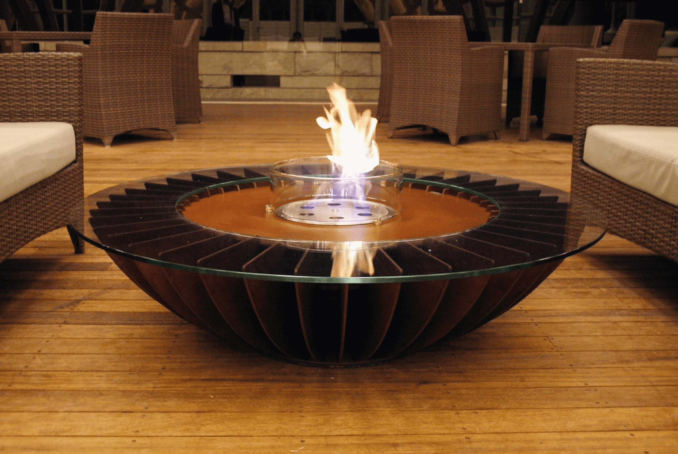 Cosmo fire pit in a Club House in South Korea, featuring a modern design with a glass top and bioethanol flame.
