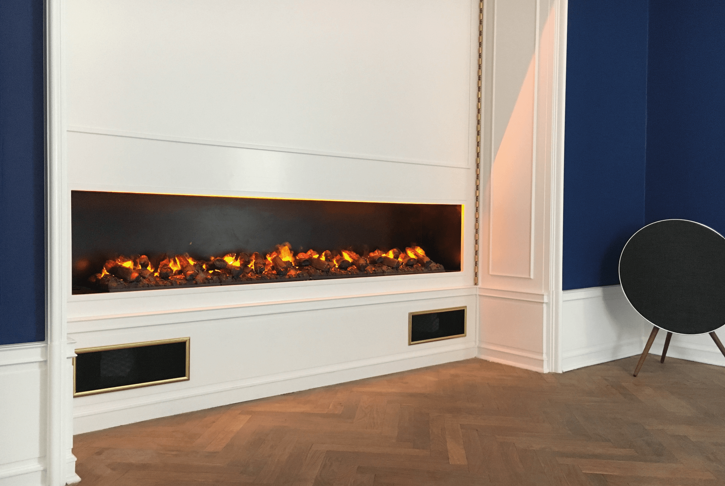 GlammFire electric fireplace in a private residence in Denmark, featuring a modern built-in design with realistic flame effects.