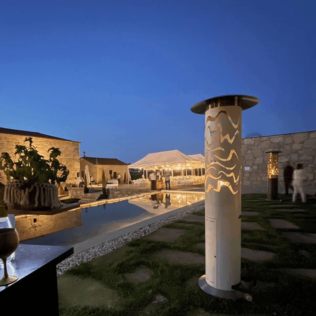 Samba Hyperion gas patio heater by GlammFire at an elegant outdoor private event beside a swimming pool