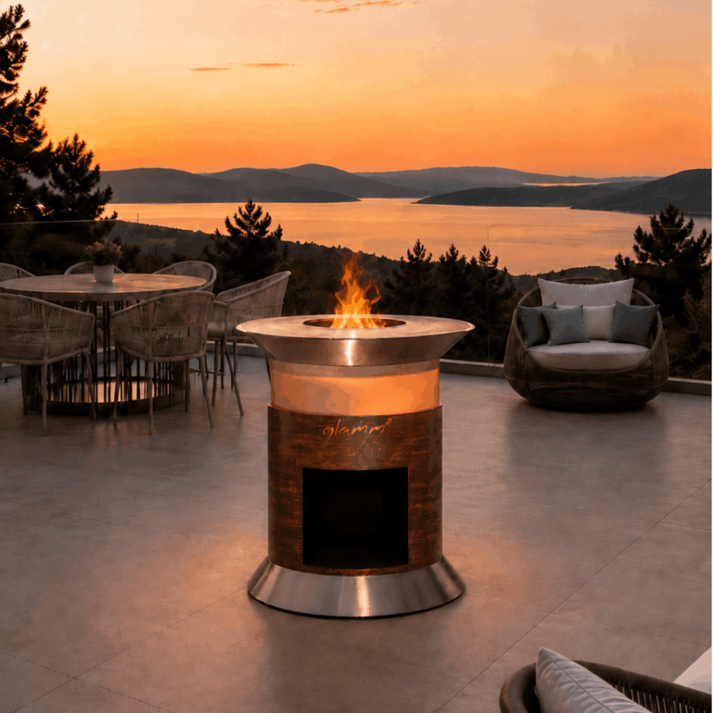 Alba Grill outdoor barbecue by GlammFire on a contemporary terrace overlooking the sea at sunset