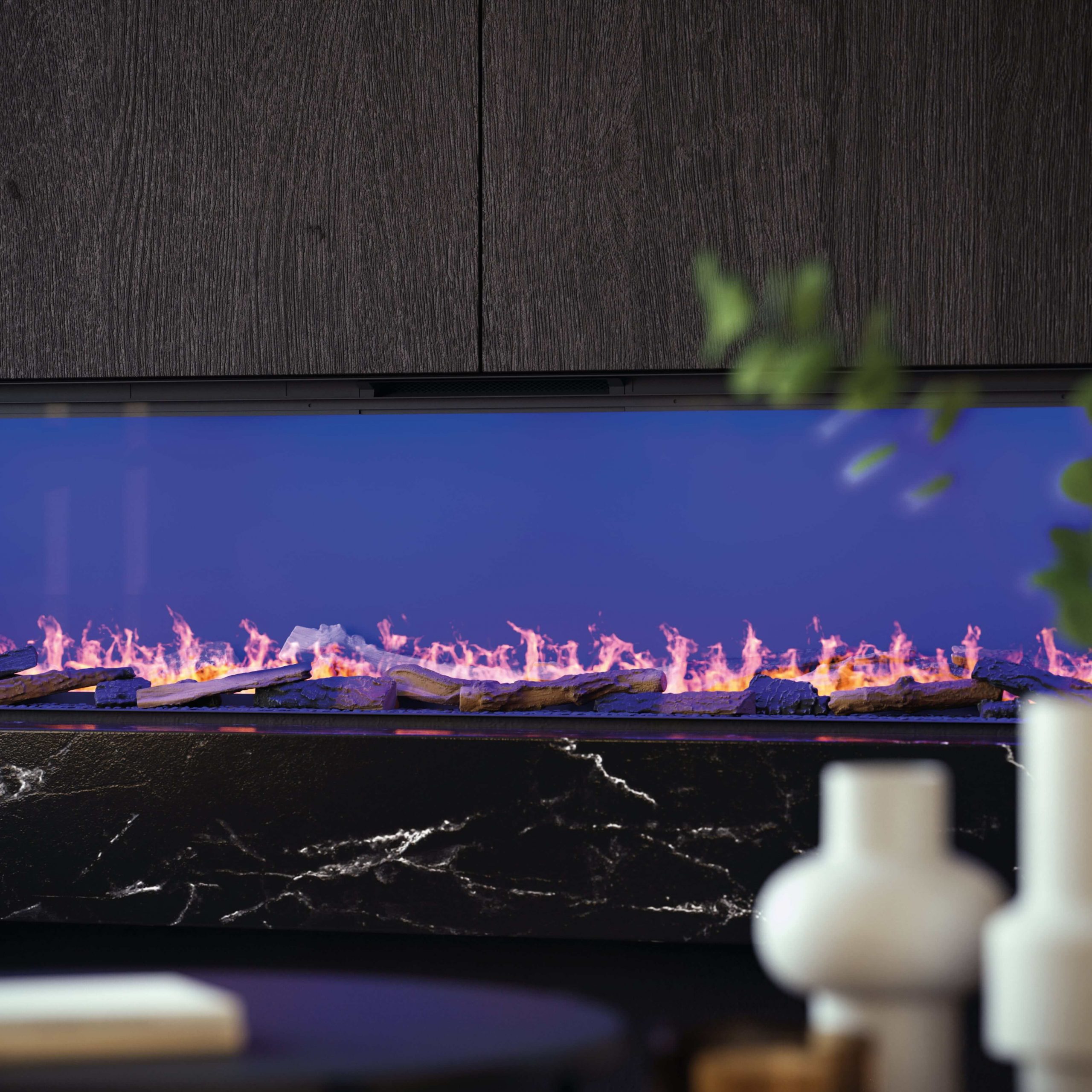 Close-up view of the Prestige electric fireplace with vibrant flames and a realistic log effect.