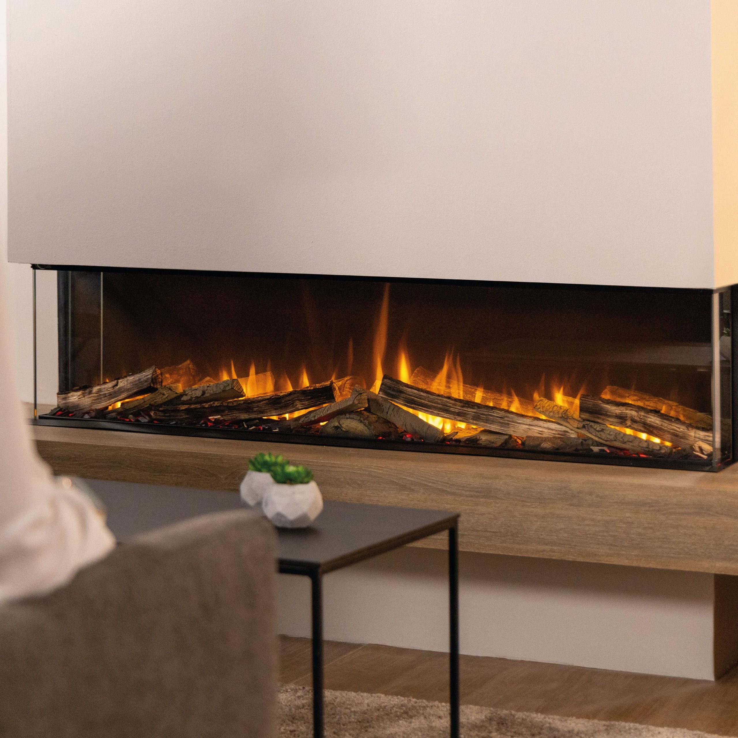 Spectrum electric fireplace with realistic flame and log display, set in a modern living room.