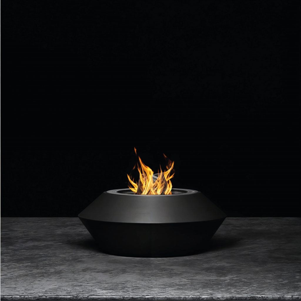 Operetta fire pit with a sleek black lacquered steel finish in a minimalist studio setting.