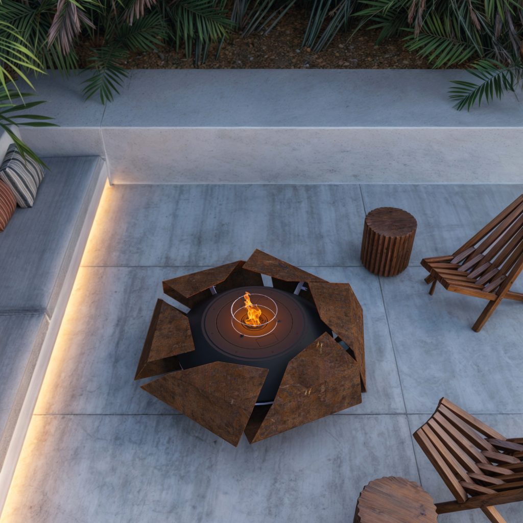 Aerial view of the Stravaganza fire pit in a cozy outdoor space, surrounded by plants and two chairs.