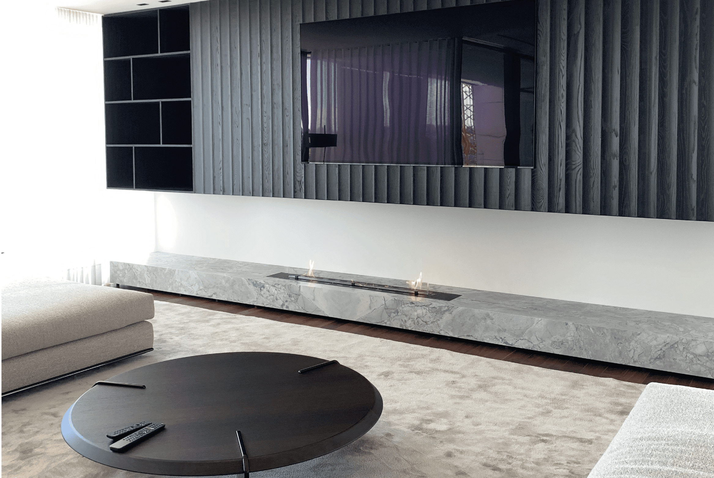 Fire Line bioethanol burner by GlammFire in a modern living room with minimalist design