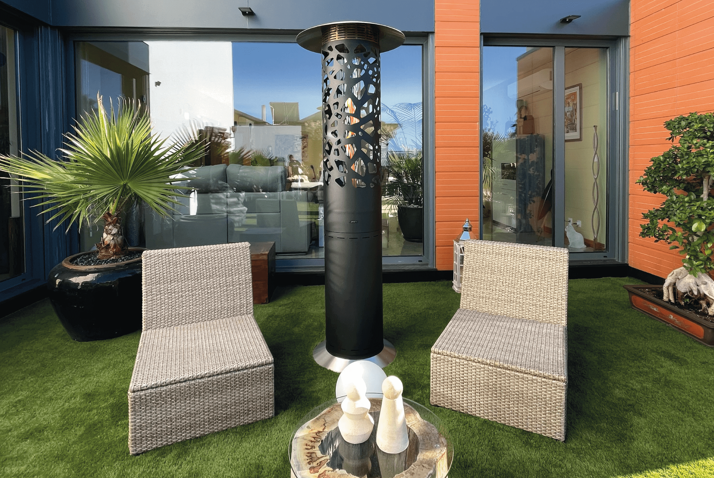 Tile Hyperion gas heater by GlammFire in a modern outdoor seating area