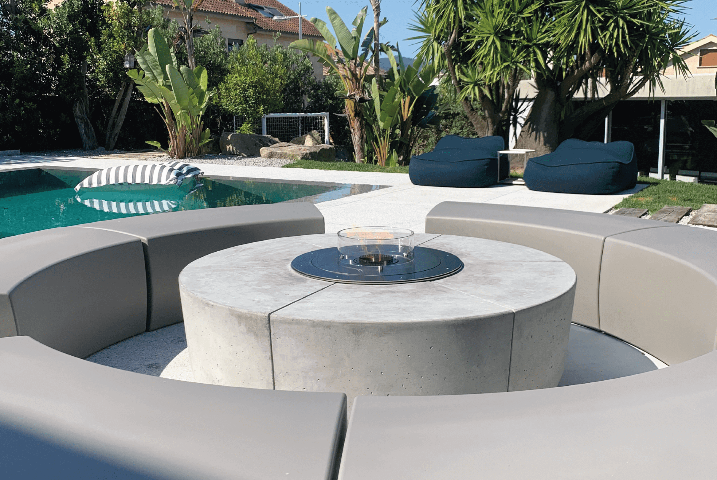 Zarzuela bioethanol fire pit by GlammFire in a modern outdoor seating area by the pool
