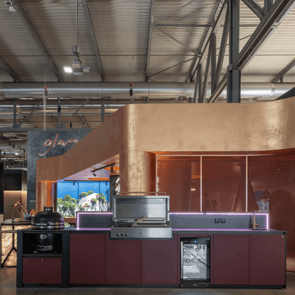 Nero Plus outdoor kitchen by GlammFire with integrated grill, kamado, wine cooler and sink in GLA Outdoor Kitchens showroom