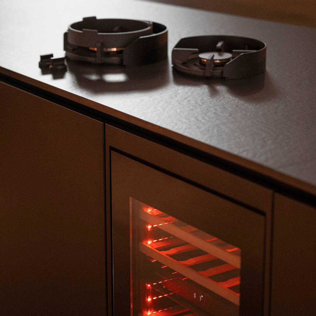 Concept outdoor kitchen by GlammFire with gas burners, Dekton worktop and integrated wine cooler