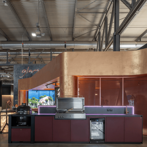 Nero Plus outdoor kitchen by GlammFire with integrated grill, kamado, wine cooler and sink in GLA Outdoor Kitchens showroom