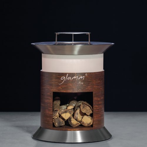 Close-up of Alba Grill by GlammFire, featuring a circular design with a fire pit and wood storage, perfect for outdoor cooking and entertaining.