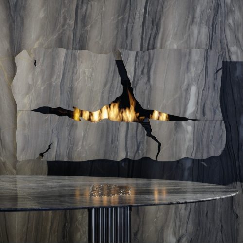 Custom-made bespoke Apollo IV bioethanol wall fireplace by GlammFire with a unique cracked design.