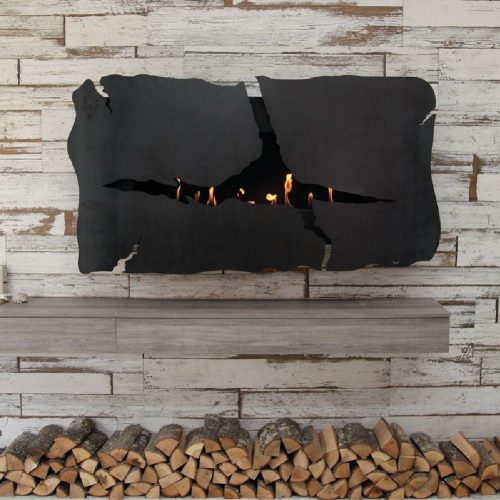 Apollo IV bioethanol wall fireplace with cracked design by GlammFire, installed in a rustic, wood-themed interior with firewood beneath.
