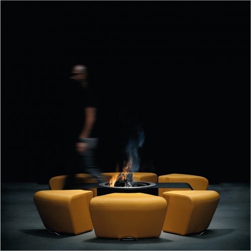 Circus fire pit with modular seating by GlammFire in a studio setting.
