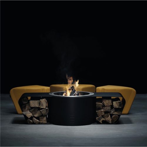 Circus fire pit with firewood storage by GlammFire in a studio setting.