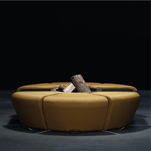 Circus fire pit by GlammFire in studio setting with log fire.