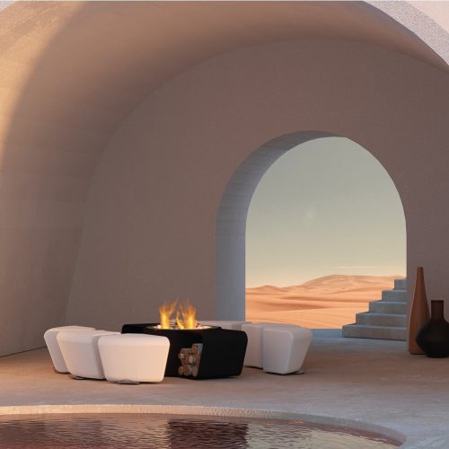 Circus fire pit by GlammFire with modular seating in an outdoor desert-inspired setting.