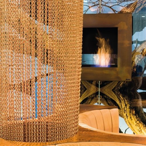 Lotus square bioethanol wall fireplace in a decorative interior setting by GlammFire