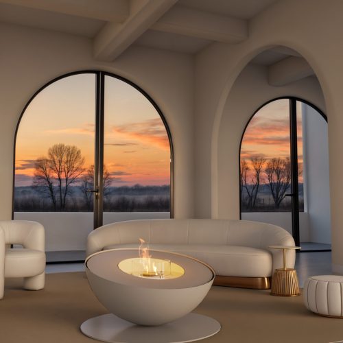 Lareira de chão Mileto a bioetanol da GlammFire em acabamento branco, integrada em sala elegante com vista para o pôr do sol.