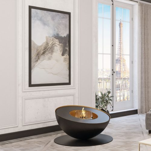 Mileto bioethanol floor fireplace by GlammFire in an elegant Parisian interior with a view of the Eiffel Tower, showcasing its sleek and modern design.