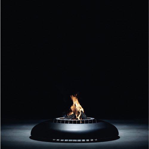 Fire pit Mime in studio with dark background highlighting the flame.