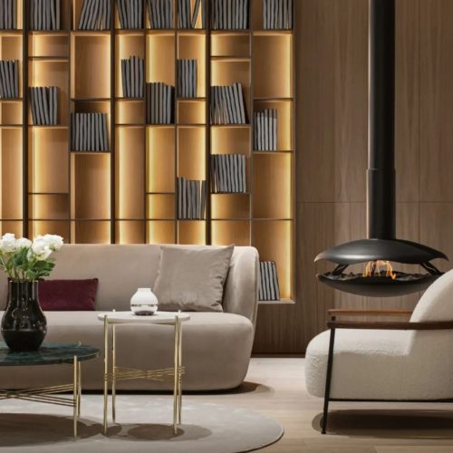 Perola suspended bioethanol fireplace by GlammFire in a modern living room with warm wood accents and elegant furniture