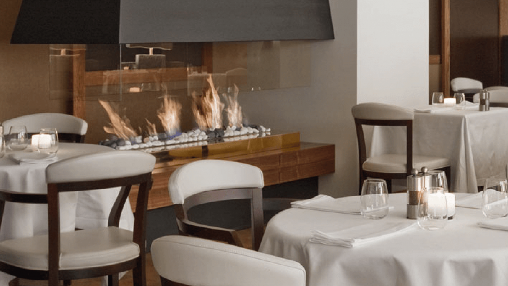 Fire Line bioethanol fireplace in a luxurious hotel spa with a pool and loungers