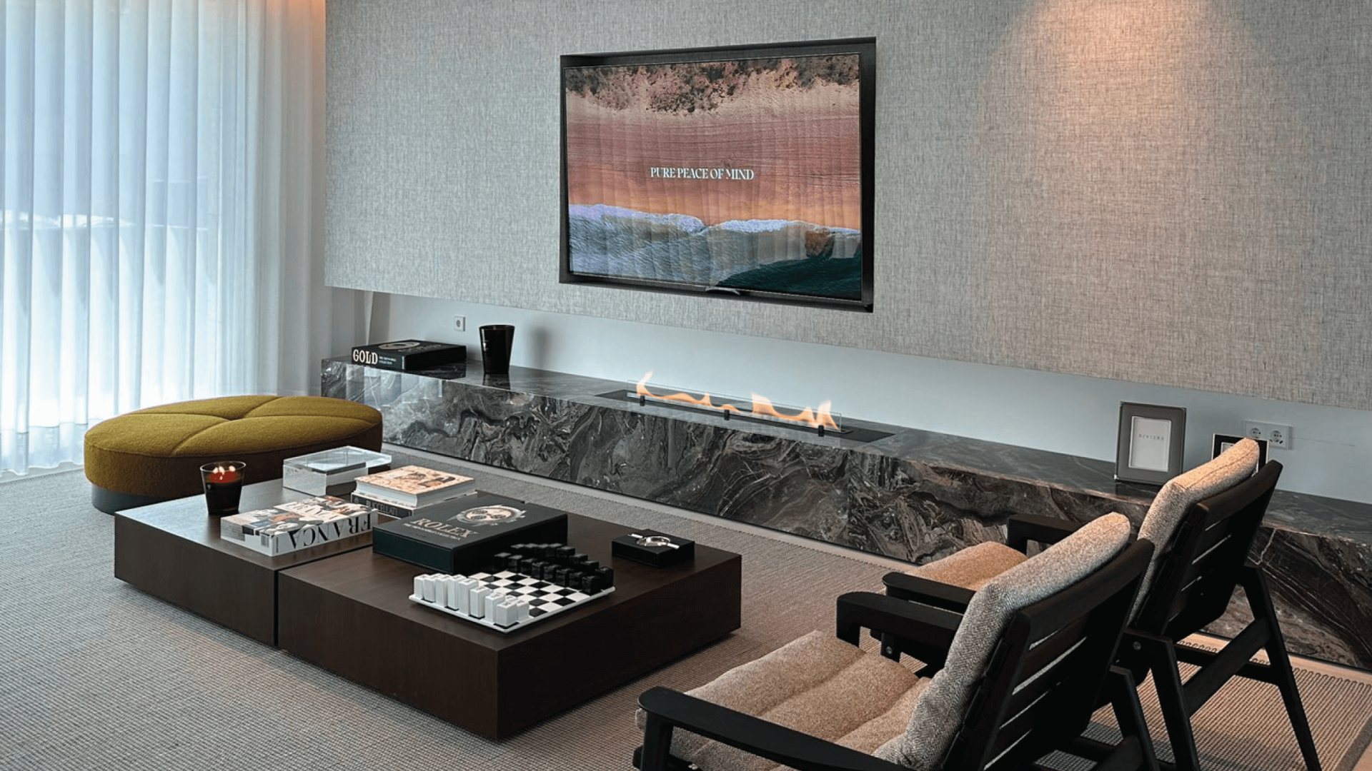 Fire Line Evoplus bioethanol fireplace in a luxurious living room integrated into a stone structure under a television