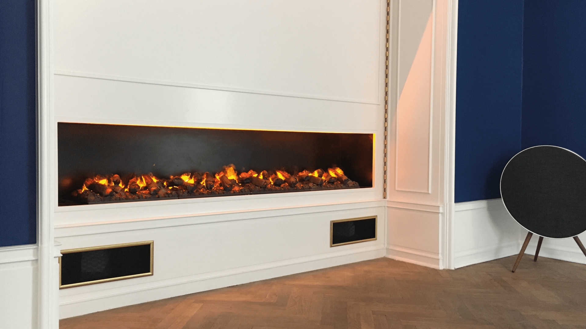 GlammFire electric fireplace in a private residence in Denmark, featuring a modern built-in design with realistic flame effects.