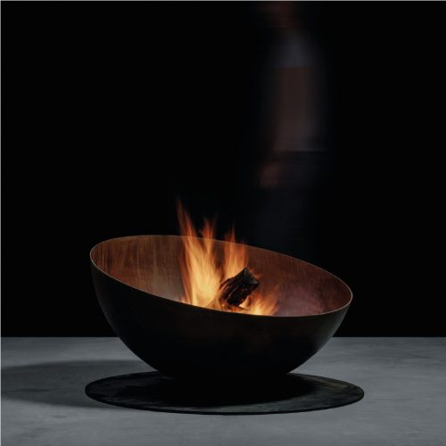 Lateral view of Fire Pit Solace with burning wood in studio setting.