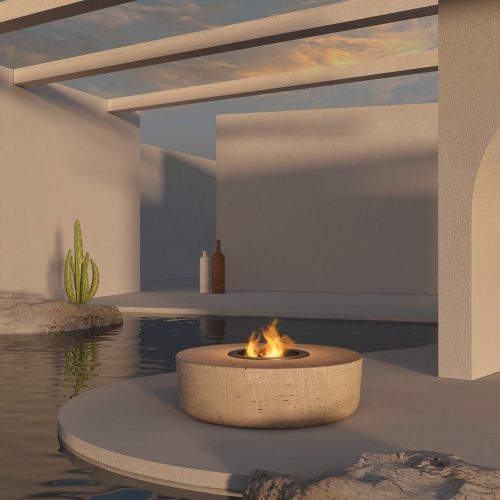 Contemporary outdoor setting with a minimalist Zarzuela Fire Pit by GlammFire, casting a warm glow next to a reflective water feature.