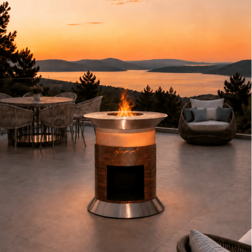 Alba Grill outdoor barbecue by GlammFire on a contemporary terrace overlooking the sea at sunset