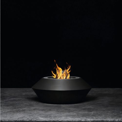 Operetta fire pit with a sleek black lacquered steel finish in a minimalist studio setting.