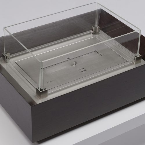 Burner II bioethanol fireplace displayed in a studio setting, showcasing its modern design and elegant flames.